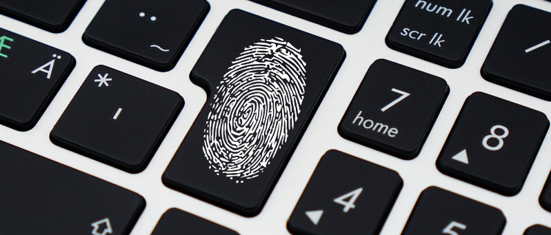 Fingerprint key on a computer keyboard symbolizing security, access control, and data governance competitive advantage in business.